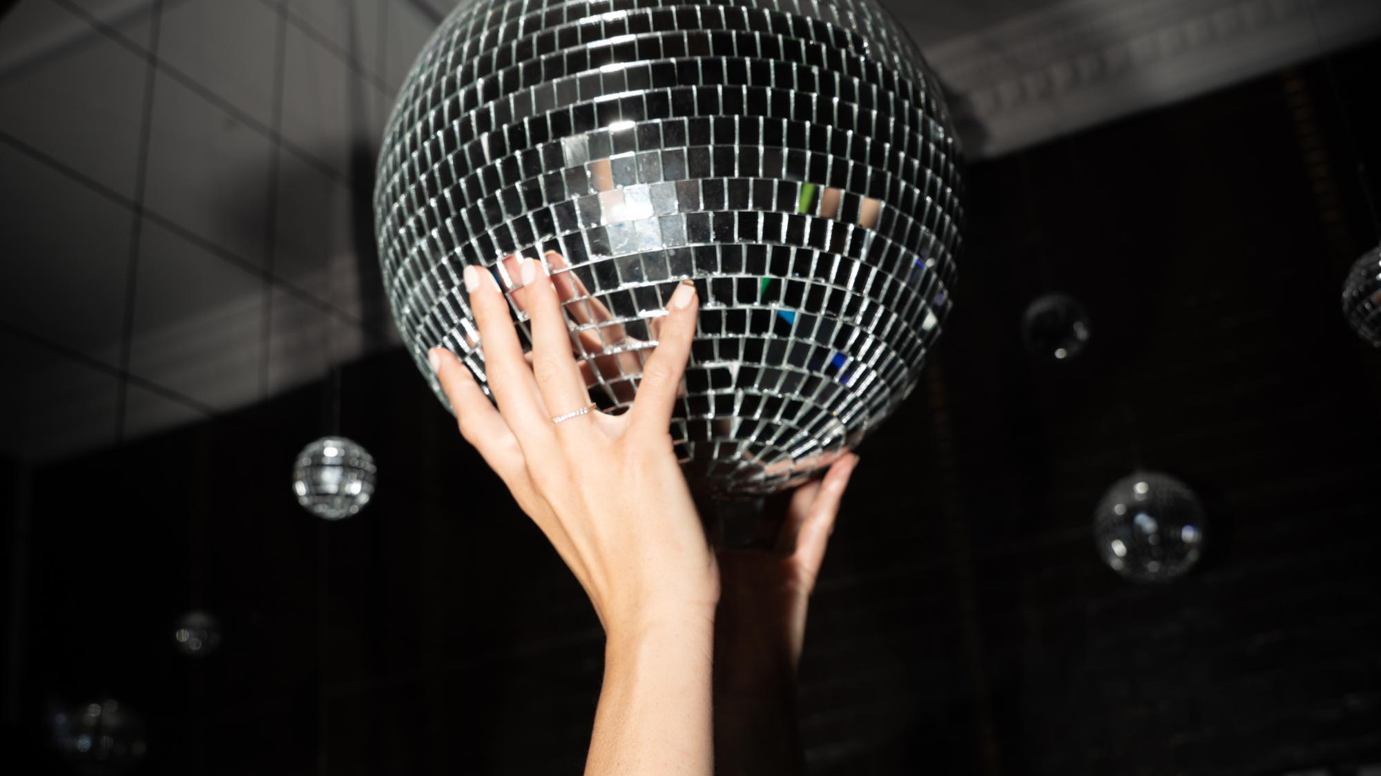 A disco ball held up to the light