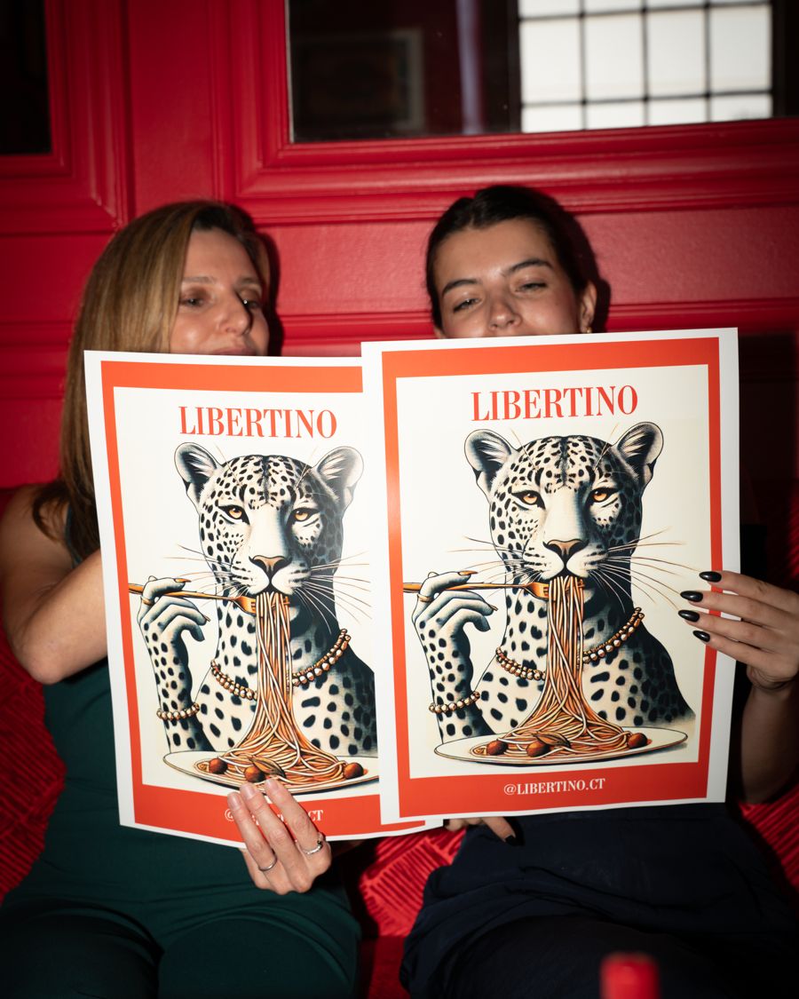 Two guests hiding behind the leopard menus