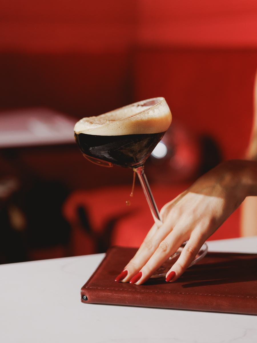 An espresso martini on a dark table